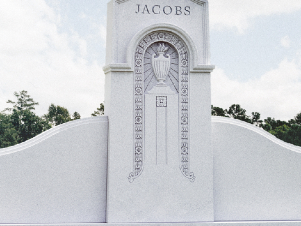 weaver-memorials-custom-monuments-4 Stone mausoleum in a cemetery.