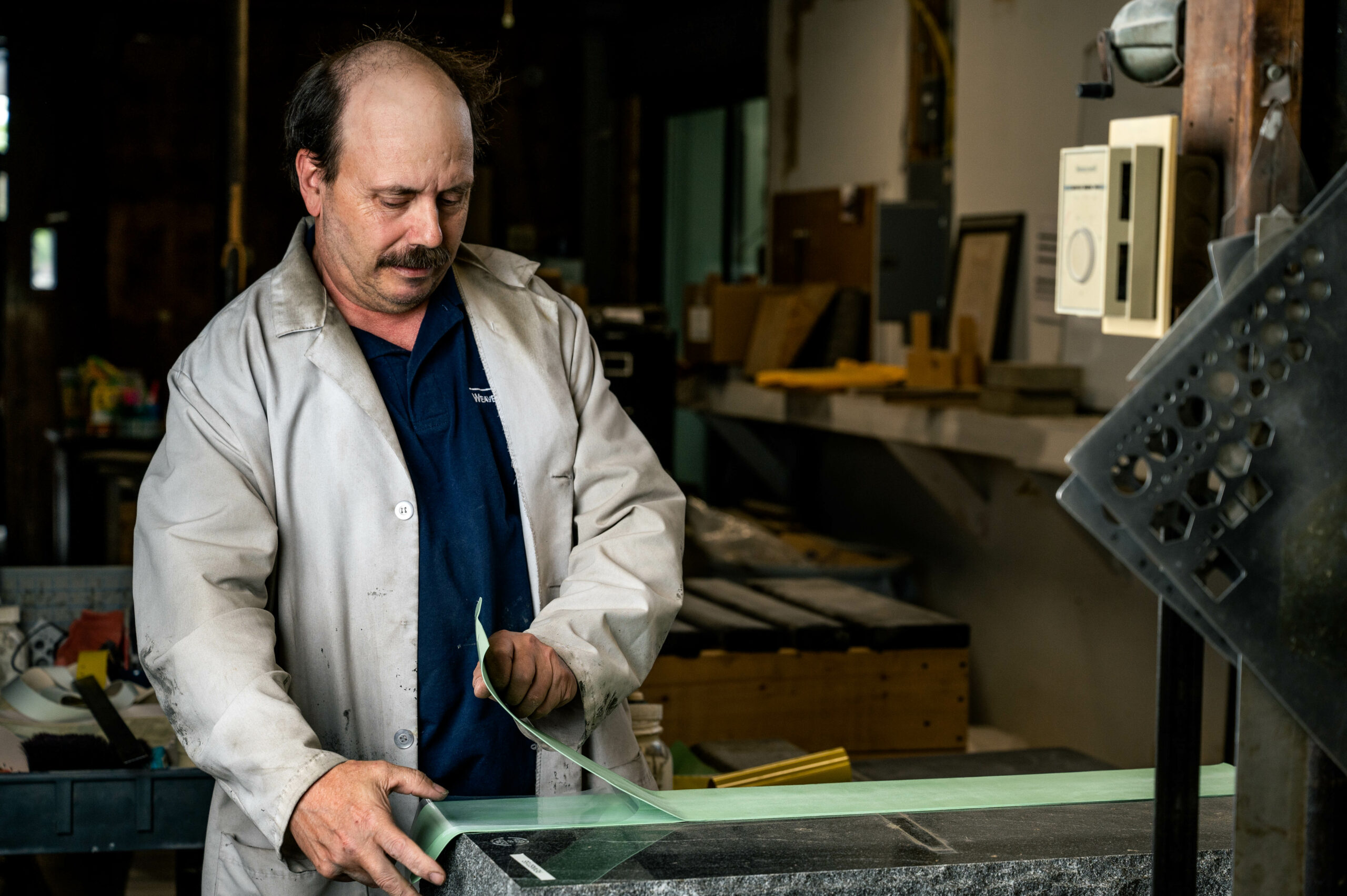 Our process - engraving 2 Inspecting a tomb stone.