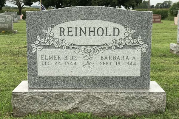 granite-monument-floral-design Granite upright headstone.