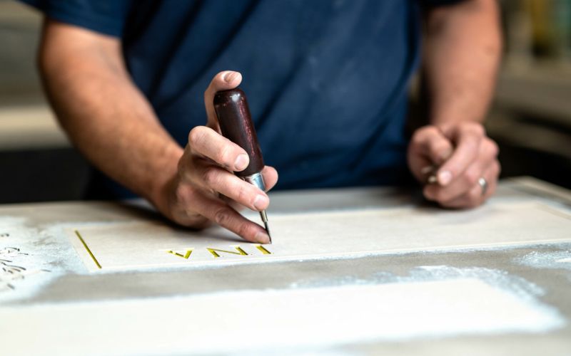 granite-slant-engraving Engraving a granite slant headstone.
